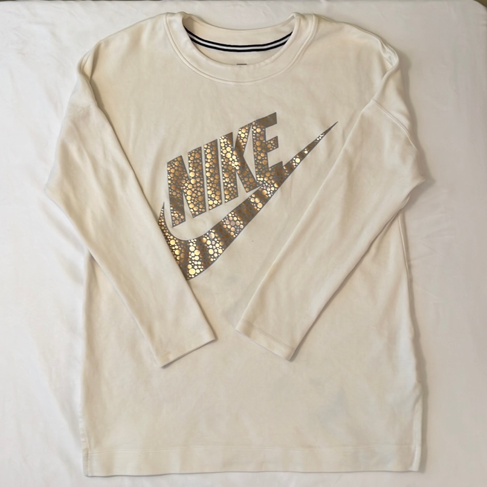 Nike, women’s tunic shirt, cream color, size large. Light blue stains.